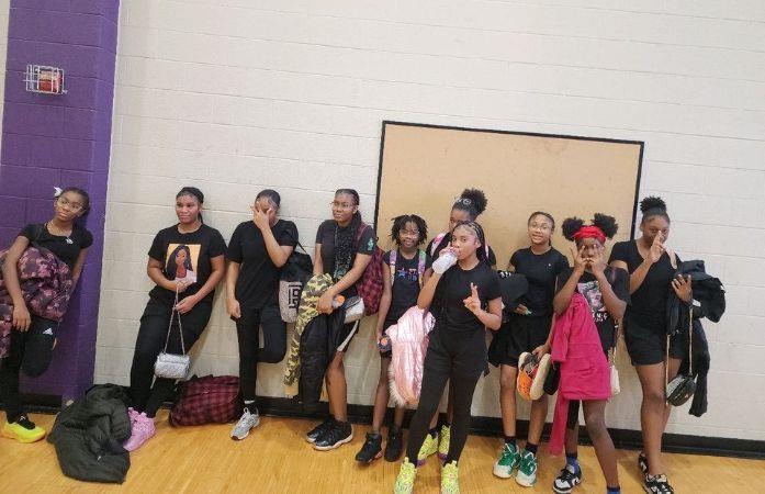 girls basketball team posing